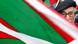 Man stands behind a Basque flag Man stands behind a Basque flag