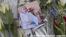 FILE - epa05443652 A photo of slain priest Jacques Hamel is seen amongst flowers at a makeshift memorial at the Saint-Etienne-du-Rouvray city hall, in Saint-Etienne-du-Rouvray, near Rouen, France, 27 July 2016. Two hostage takers were killed by the police after they took hostages at a church in Saint-Etienne-du-Rouvray. Jacques Hamel was killed by one of the perpetrators. EPA/IAN LANGSDON (zur Vorberichterstattung zum Thema Öffentliche Trauerfeier für den von Islamisten ermordeten Priester Jacques Hamel vom 02.08.2016) +++(c) dpa - Bildfunk+++ | picture alliance/dpa/I. Langsdon
