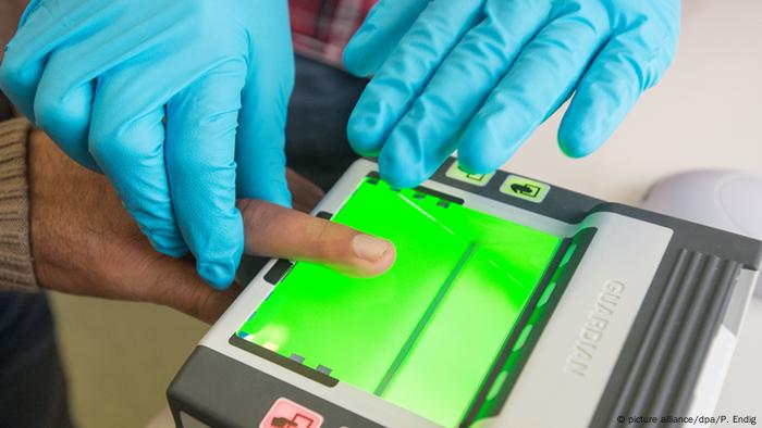 A finger being scanned on an electronic device