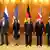 UN Security Council permanent five foreign minister pose with German FM Steinmeier in front of their respective flags in Berlin
