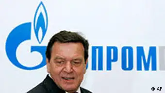 Former German Chancellor Gerhard Schroeder in front of a Gazprom sign