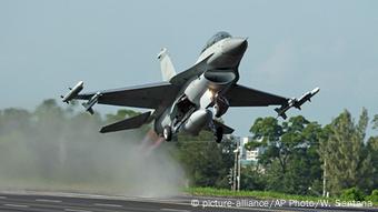 A fighter jet taking off