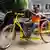 Robert Mboyo mit einem Dreirad Marke Eigenbau Foto: Simone Schlindwein