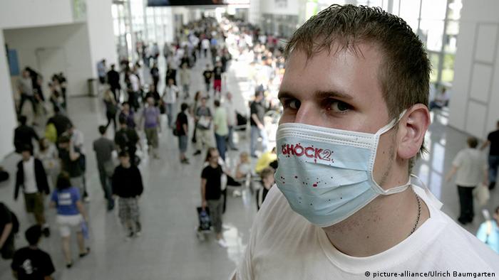 Man wearing mask to protect against swine flu