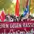 "Debout contre le racisme" est écrit sur une banderole lors d'une manifestation à Berlin en 2016.