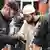 Salafist man undergoing a police inspection