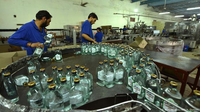 A gin assembly line in Pakistan