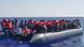 Migrants crossing the Mediterranean in a boat Migrants crossing the Mediterranean in a boat