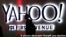 Oct. 26, 2015 FILE - In this Nov. 5, 2014, file photo, a person walks in front of a Yahoo sign at the company's headquarters in Sunnyvale, Calif. Yahoo announced Wednesday, March 2, 2016, that the company is adding a new component to its Sports vertical: competitive video gaming. Yahoo said that Esports will offer video coverage of live tournaments, including expert commentary and interviews with top players. Esports will also include articles, scores, team rosters, schedules, player rankings, calendars and statistics. (AP Photo/Marcio Jose Sanchez, File) | (c) picture-alliance/AP Photo/M. Jose Sanchez