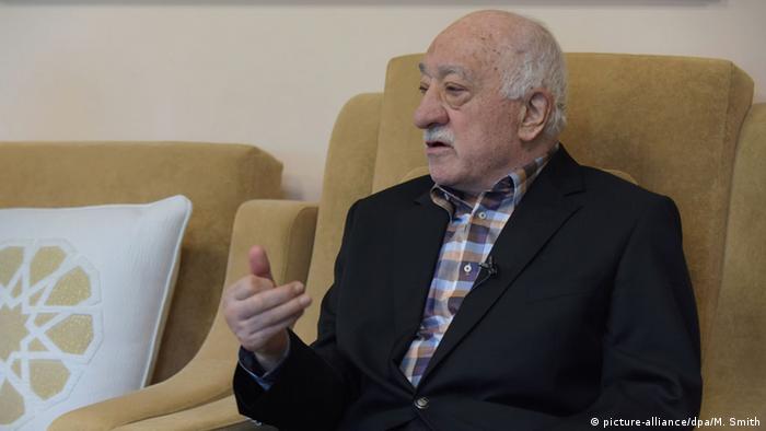 Gulen sits at his home in a chair