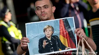 Deutschland München Ankunft von Asylsuchenden Poster Merkel