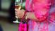 A woman holding a champagne glass at an exlusive party A woman holding a champagne glass at an exlusive party
