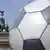 A giant soccer ball with the Brandenburg Gate in the background.