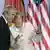 President Bush confers with German Chancellor Angela Merkel after a press conference in Germany in 2006