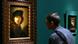 A man looks at a self-portrait of Rembrandt (1634) in Berlin's Gemaelde Galerie A man looks at a self-portrait of Rembrandt (1634) in Berlin's Gemaelde Galerie