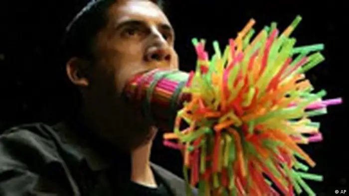 Marco Hort sets record with 259 straws stuffed in his mouth 