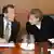 Franz Müntefering et Angela Merkel leur parti respectif s'opposent sur la question du salaire minimum