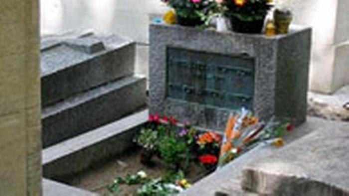 Tomb set with stone and decorated with flowers