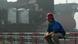A Chinese shipyard worker takes a break near a crude oil vessel A Chinese shipyard worker takes a break near a crude oil vessel