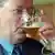Steinbrück drinking a glass of beer