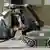 A bomb-defusing robot at "Security 2006" handles a bag with its forward arm