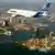 An A380 jet flies over Sydney's harbor