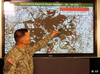 A US military spokesman points to a map of Iraq