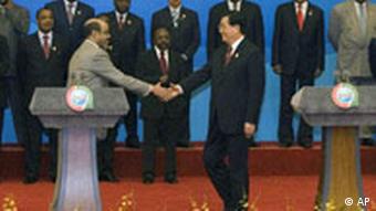 Chinese President Hu Jintao, front right shake hands with Ethiopia's Prime Minister Meles Zenawi