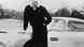Actor Sean Connery as James Bond leans against his Aston Martin car Actor Sean Connery as James Bond leans against his Aston Martin car