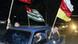 Waving the flags, from left, of Russia and the two Georgian breakaway provinces, Abkhazia and South Ossetia, local residents ride a car Waving the flags, from left, of Russia and the two Georgian breakaway provinces, Abkhazia and South Ossetia, local residents ride a car