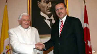 Pope shakes hands with Turkish PM Erdogan
