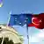 Flags of Turkey and the European Union in front of a mosque