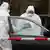 Investigators of the Federal Agency for Radiation Protection examine a BMW car