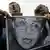 Demonstrators hold a photo of Anna Politkovskaya during a rally on Pushkin square in downtown Moscow
