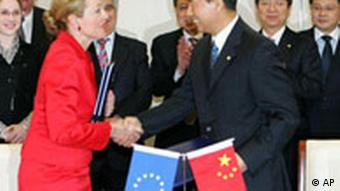 EU Commissioner for External Relations Benita Ferrero-Waldner, front left, and Chinese Vice Minister of commerce Yi Xiaozhun