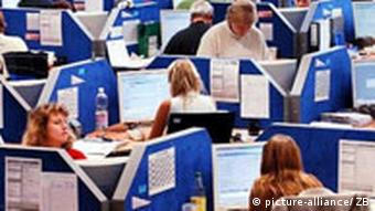 Many peope working in an office