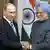 Vladimir Putin, left, shakes hands with Indian Prime Minister Manmohan Singh