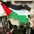 Palestinians waving their flag