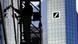 A man cleans windows at Deutsche Bank's headquarters in Frankfurt A man cleans windows at Deutsche Bank's headquarters in Frankfurt