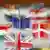In der Mitte des Fotos ist die Fahne der EU, darum verteilen sich die Fahnen unterscheidlicher Länder, das Bild ist leicht verwischt. Quelle: AP