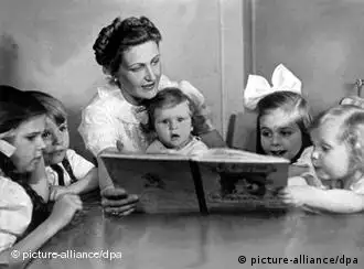 Magda Goebbels reading a book to her children