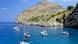 Yachts anchored in the blue water of the Mediterranean off Mallorca Yachts anchored in the blue water of the Mediterranean off Mallorca