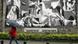 A man passes a replica of Pablo Picasso's "Guernica" in the center of the Basque town of Guernica, Spain A man passes a replica of Pablo Picasso's "Guernica" in the center of the Basque town of Guernica, Spain
