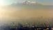 Smog over Mexico city with volcano in the background Smog over Mexico city with volcano in the background