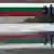 People walk past a Bulgarian flag painted on wall