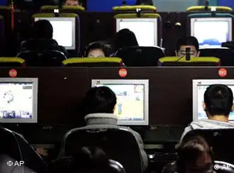 **FILE** Chinese Internet surfers play online games at an Internet cafe in Beijing, China, in this Wednesday, Feb. 15, 2006 file photo. China is tightening controls on blogs and search engines to block material deemed subversive or immoral, the government said Friday June 30, 2006. The announcement comes amid a media crackdown by President Hu Jintao's government, with Web sites being shut down and journalists jailed. (AP Photo)