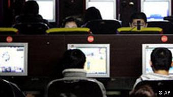 People sitting in front of computer screens