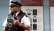 A police officer stands guard outside Scotland Yard A police officer stands guard outside Scotland Yard