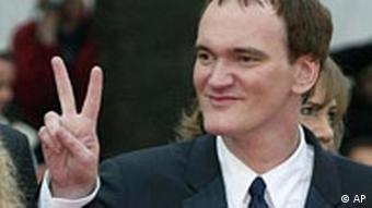 Quentin Tarantino making a victory sign