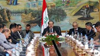 Iraqi Prime Minister Nouri al-Maliki, center, meets with local government officials in his office in Baghdad